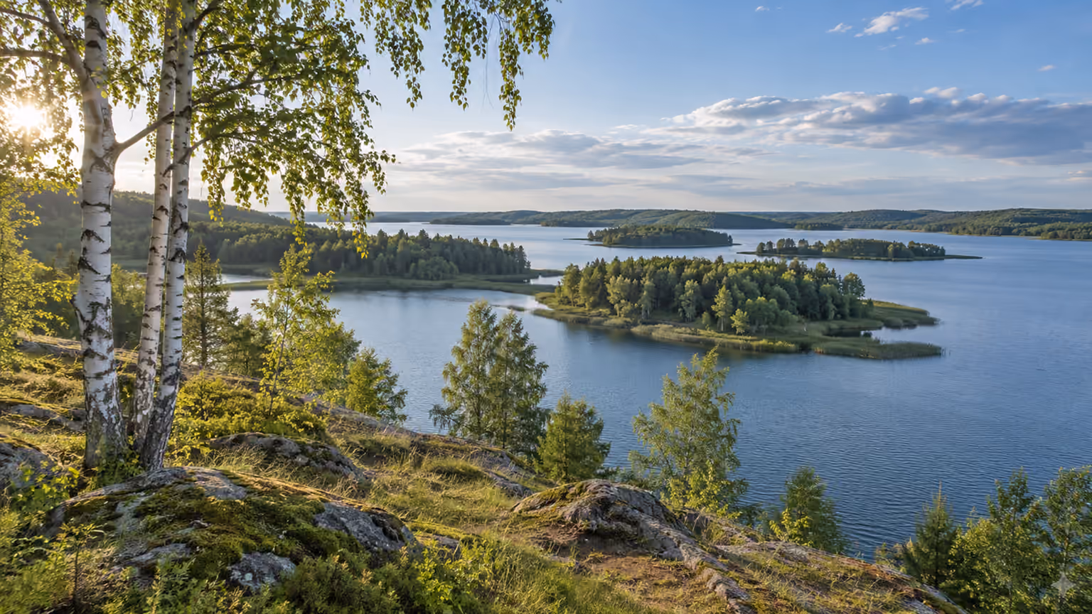 Blue lakes and forested islands across the rolling countryside of northern Belarus