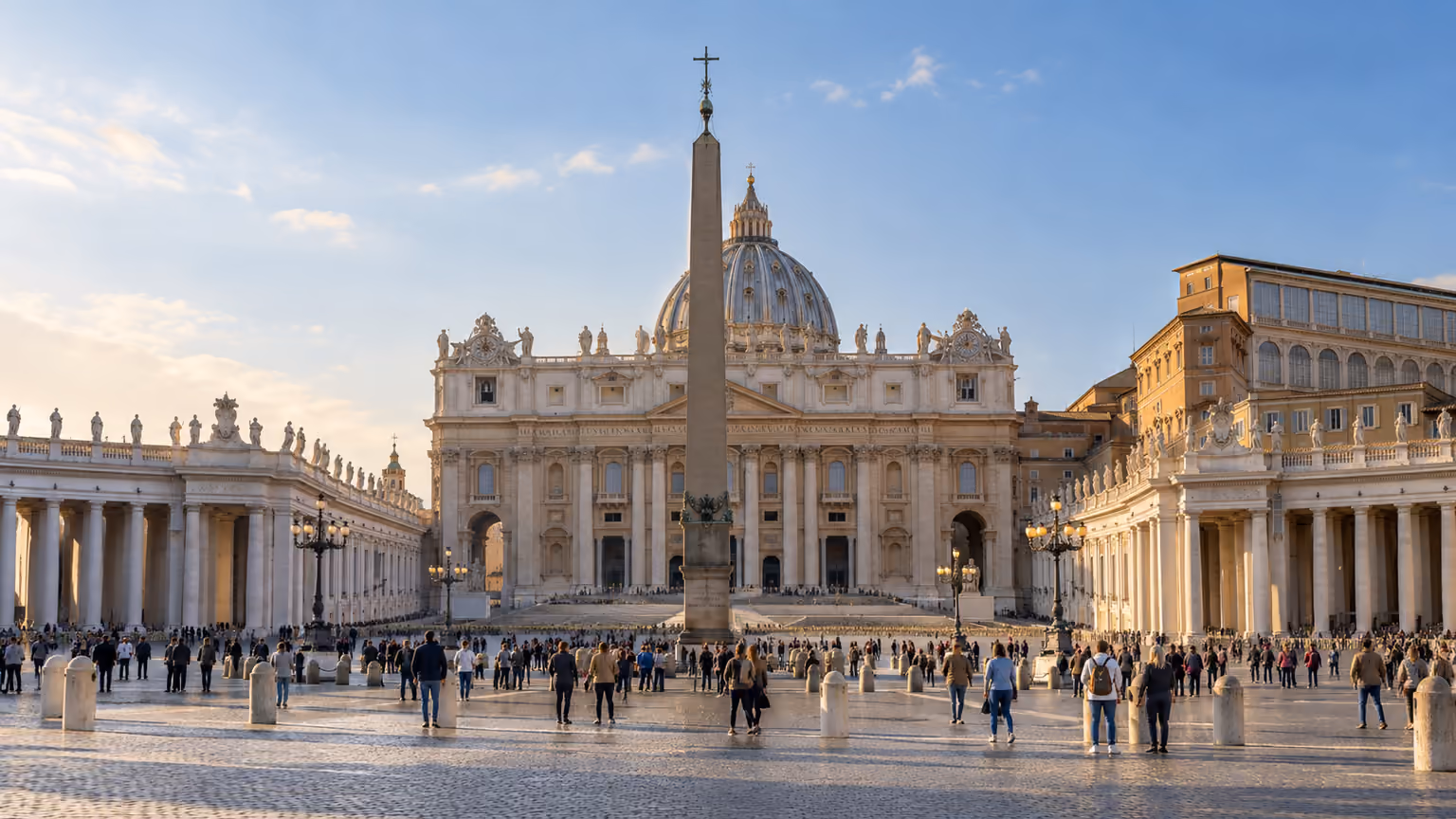 Saint Peter’s Basilica and its colonnaded square viewed in warm daylight in Vatican City